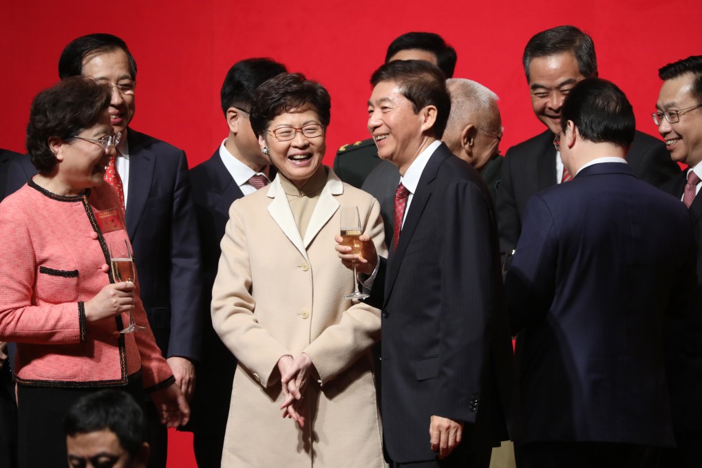Chief Executive Carrie Lam Cheng Yuet-ngor, Luo Huining, the new director of the central government’s liaison office, and others attend the office’s Lunar New Year reception on January 20. Photo: Sam Tsang