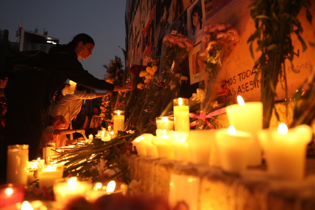 Women attend a vigil for victims of femicide at the Column of the Angel of Independence in Mexico City on Saturday. Photo: EPA