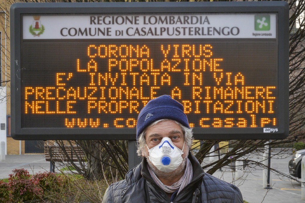 A man wearing a protective face mask in Casalpusterlengo, one of the northern Italian towns placed under lockdown because of the virus outbreak. Photo: EPA