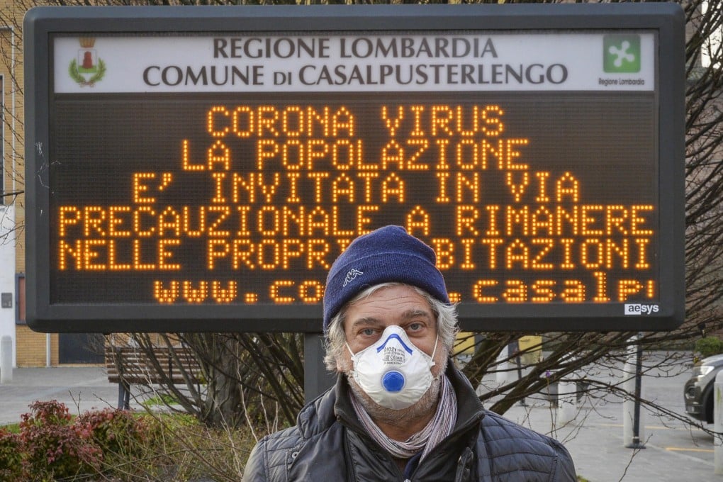 A man wearing a protective face mask in Casalpusterlengo, one of the northern Italian towns placed under lockdown because of the virus outbreak. Photo: EPA
