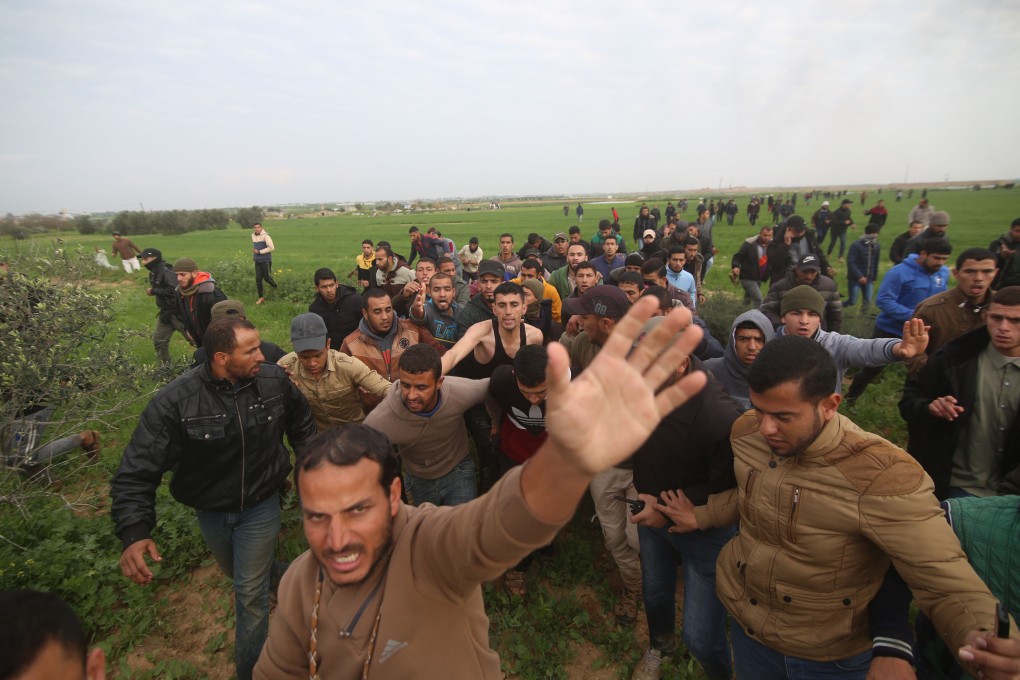 Palestinians react after a compatriot was killed during a confrontation along the border with Israel. Photo: Xinhua