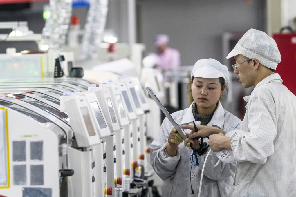 People work on machines at the Foxconn factory in Guiyang, Guizhou Province, China, 28 May 2018. File photo: EPA-EFE