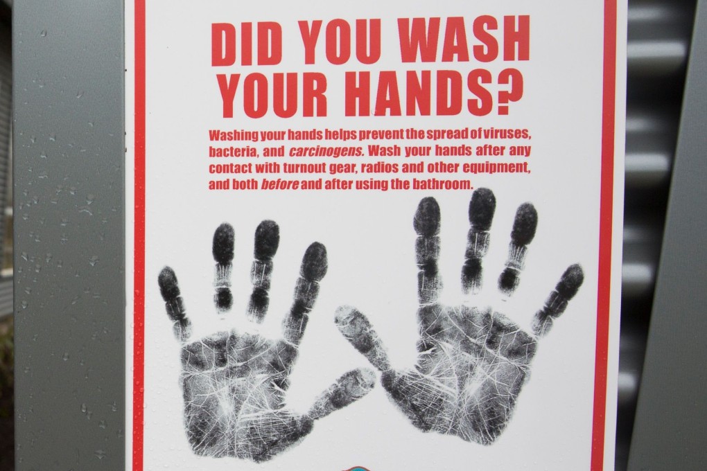 A sign reminding people to wash their hands outside a dormitory at the Washington State Patrol Fire Training Academy which has been designated as a 2019 novel coronavirus quarantine site for travellers. Photo: AFP