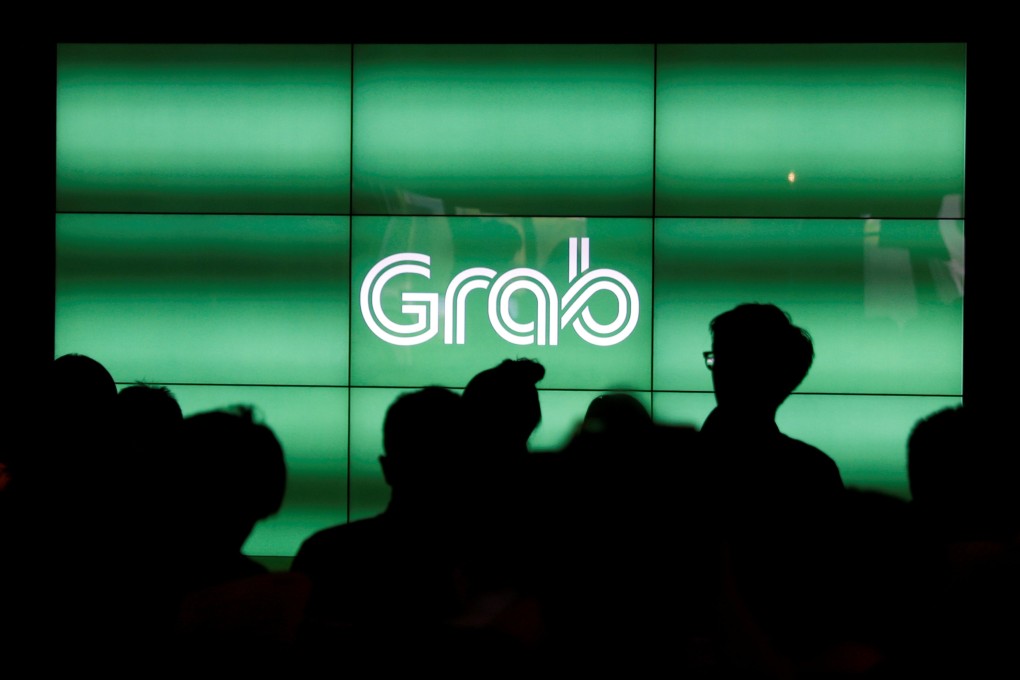 Ride-hailing provider Grab will co-develop a range of app-based financial products for Southeast Asia with its new investors, banking giant Mitsubishi UFJ Financial Group and data centre services firm TIS. Photo: Reuters