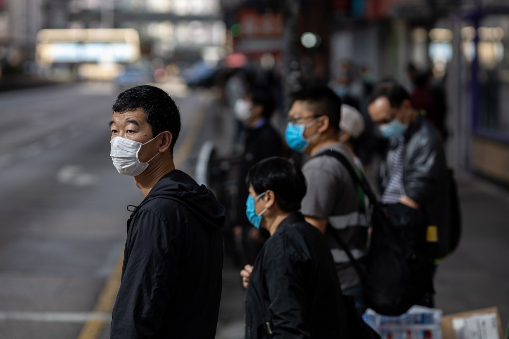 People wear face masks in Mong Kok on February 25. It is simply not possible for all in Hong Kong to use masks without creating a severe shortage. If we all use them, we would need a minimum of 200 million a month. Photo: EPA-EFE