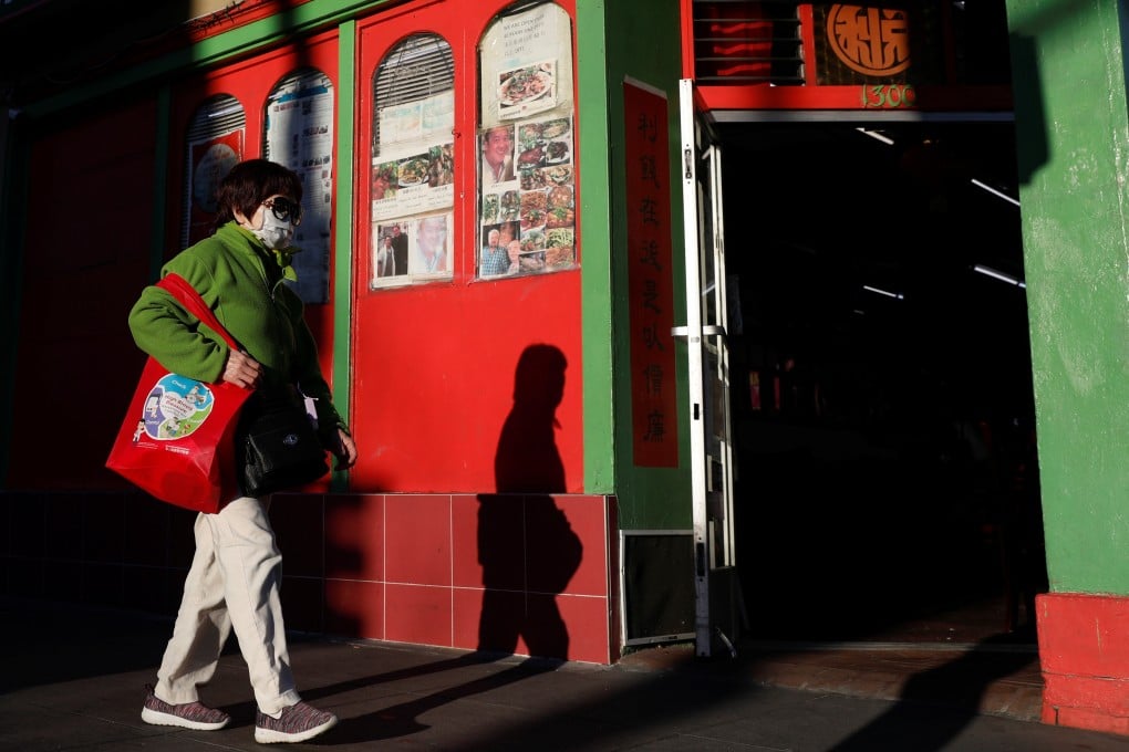 A woman wearing a face mask walks through San Francisco’s Chinatown. Photo: Reuters