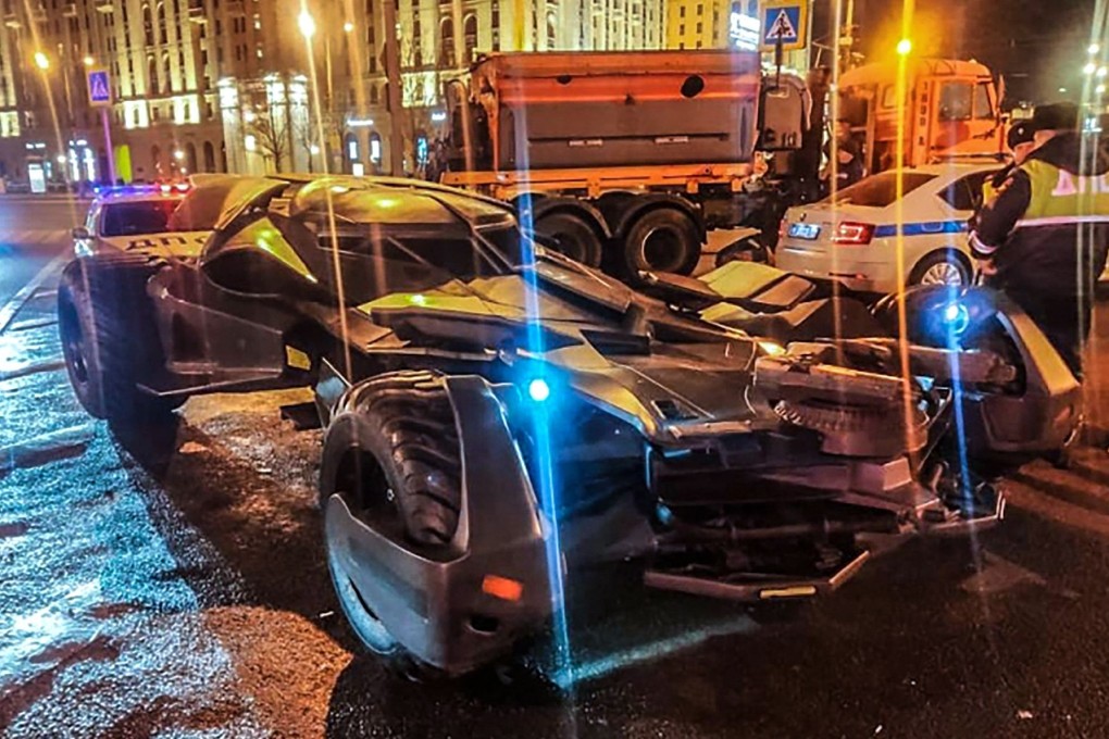 Russian traffic policemen on Saturday stand next to a vehicle in Moscow that bears a striking resemblance to the Batmobile from “Batman v Superman”. Photo: Interior Ministry of Russia via AFP