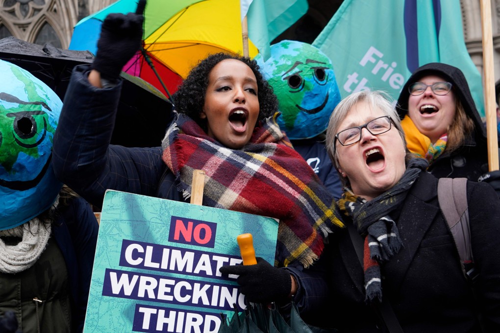 Campaigners against Heathrow expansion celebrate outside the Royal Courts of Justice in London. Photo: AFP