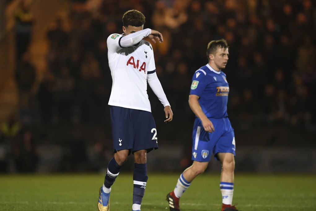 Tottenham Hotspur's Dele Alli, left, reacts alongside Colchester United's Tom Lapslie during an English League Cup match. Photo: AP