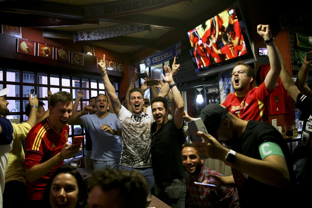 Spain fans watch the Russia 2018 World Cup match between Spain and Iran in a bar in Madrid. Photo: AP