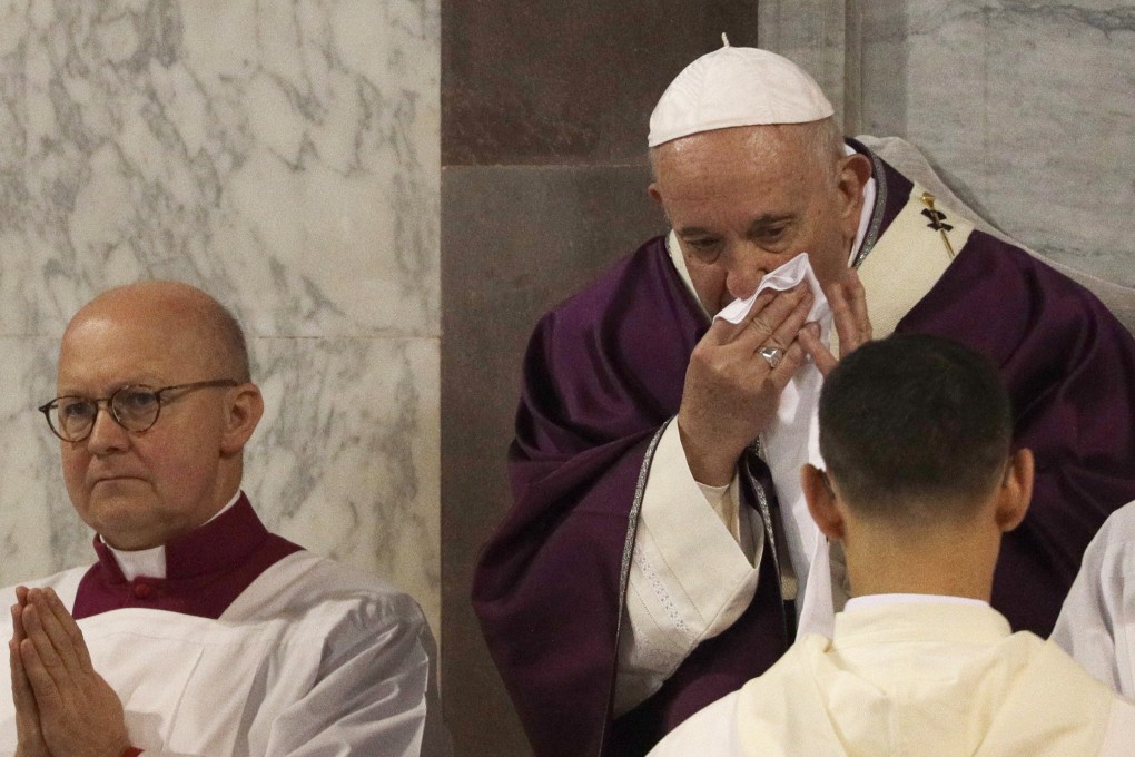 Pope Francis wipes his nose during Ash Wednesday Mass inside the Basilica of Santa Sabina in Rome. Photo: AP