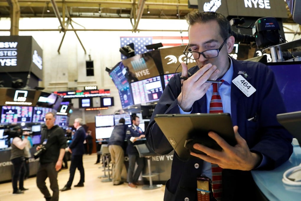 Traders work on the floor at the New York Stock Exchange on Thursday. Photo: Reuters