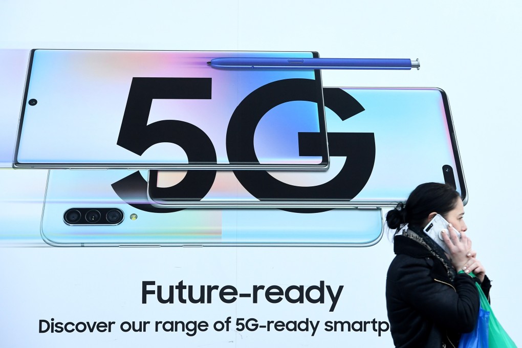 A pedestrian walks past an ad displaying a 5G sign in London on January 29. The US has been putting pressure on its allies to ban the Chinese telecom giant from their 5G networks. Photo: EPA-EFE