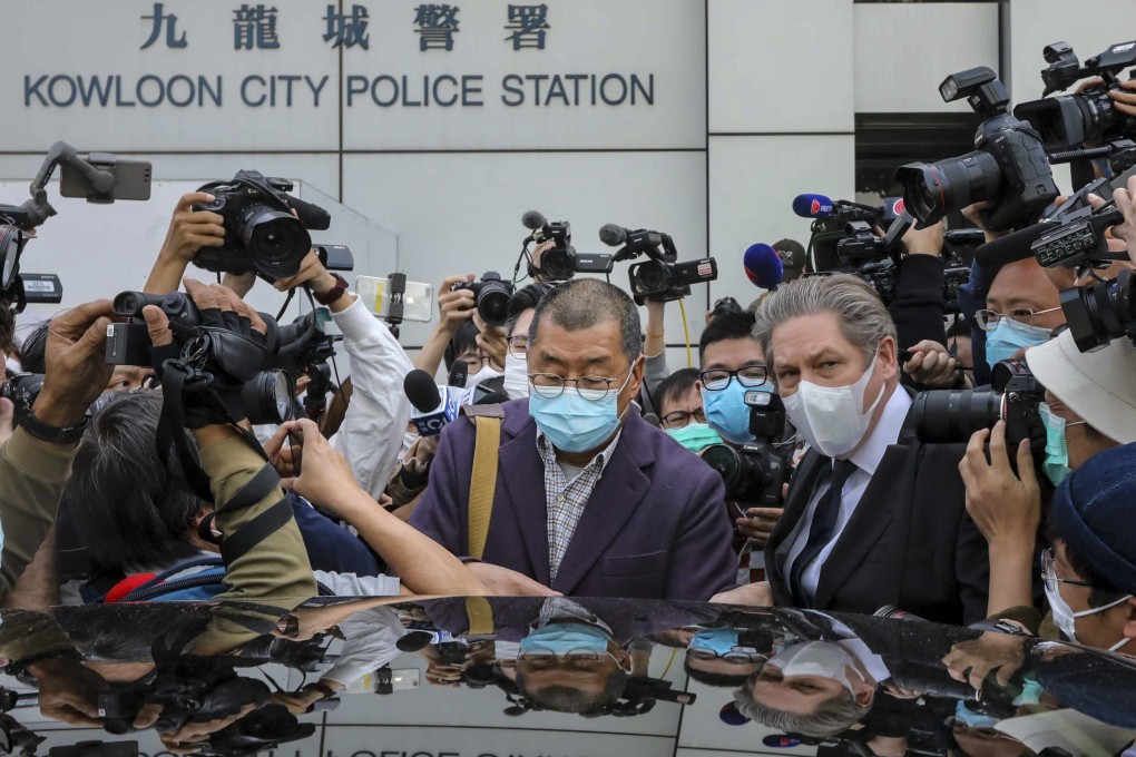 Jimmy Lai surrounded by the press outside Kowloon City Police Station. He was arrested on Friday morning at his home in Ho Man Tin. Photo: Felix Wong