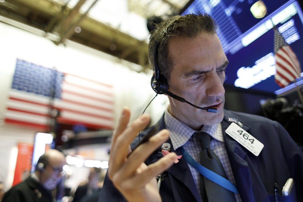 Traders work on the floor of the New York Stock Exchange on Friday. Photo: EPA-EFE