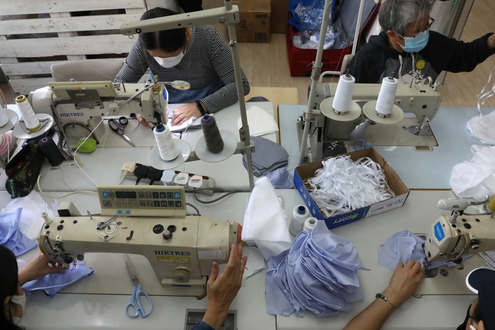 Workers at a mask factory in Hong Kong. Photo: K.Y. Cheng