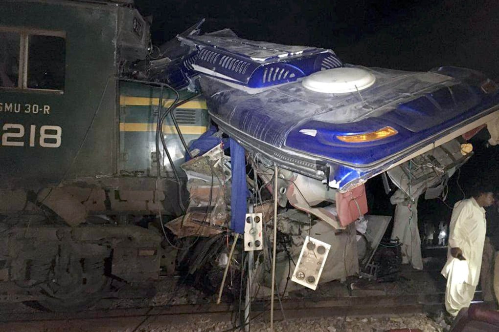 The wreckage of a bus is seen after it was hit by a train in Pakistan’s Sindh province on Friday. Photo: Xinhua