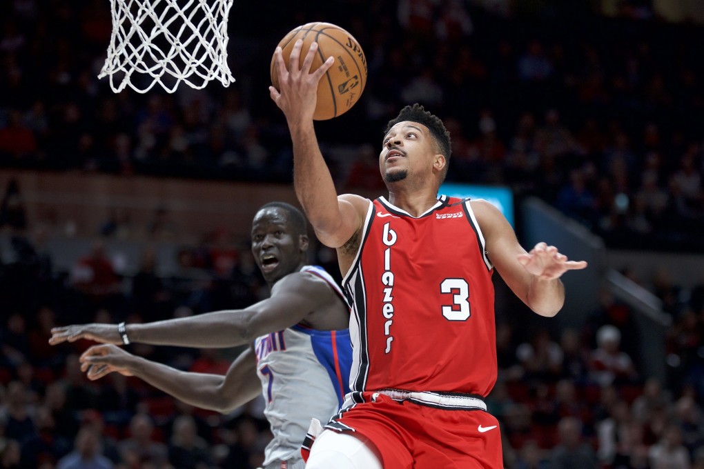 Portland Trail Blazers guard CJ McCollum shoots over Detroit Pistons forward Thon Maker in the NBA on February 23, 2020. Photo: AP