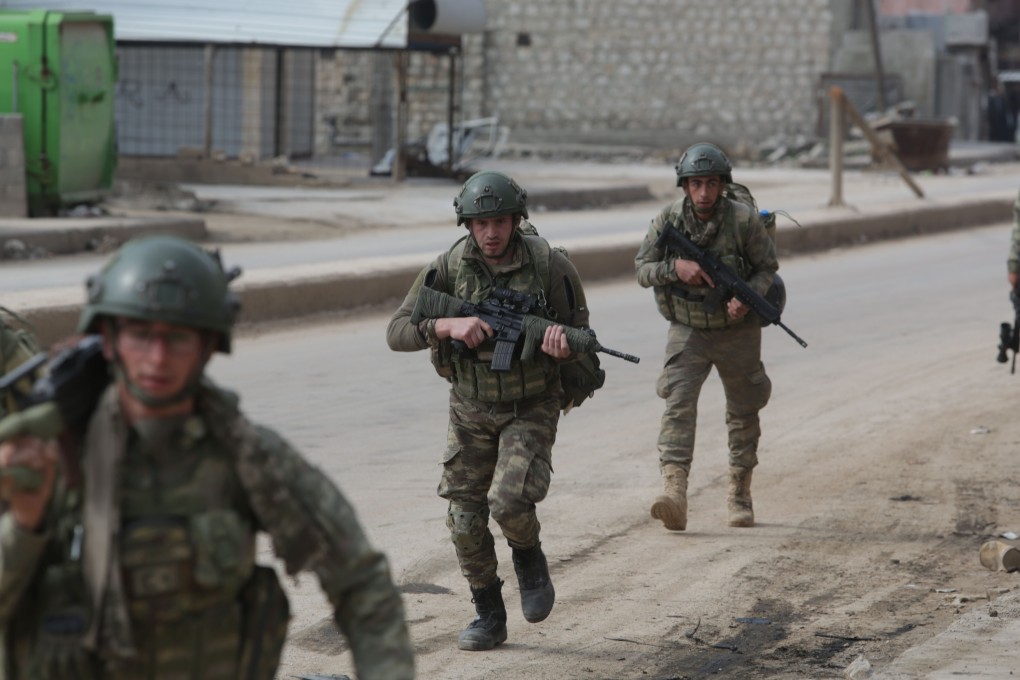 Turkish troops patrol in the town of Atareb in the rebel-held western countryside of Syria’s Aleppo province. Photo: AFP
