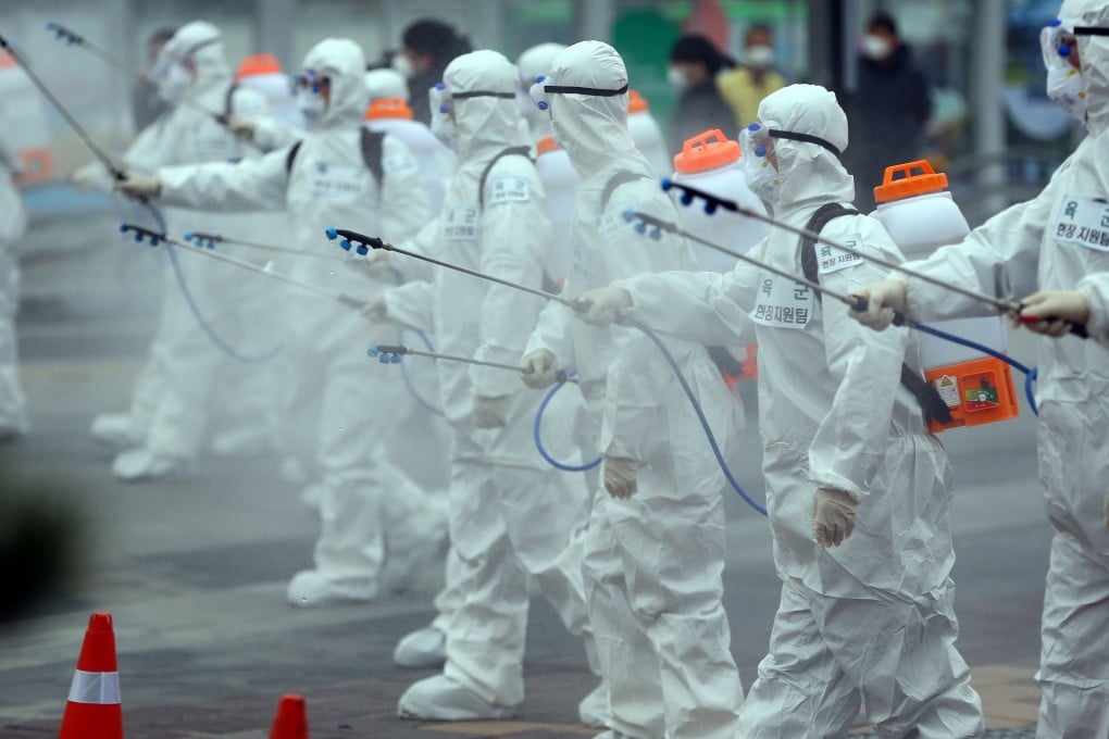 South Korean soldiers wearing protective gear sanitise Daegu railway station in Daegu, South Korea. Photo: Reuters