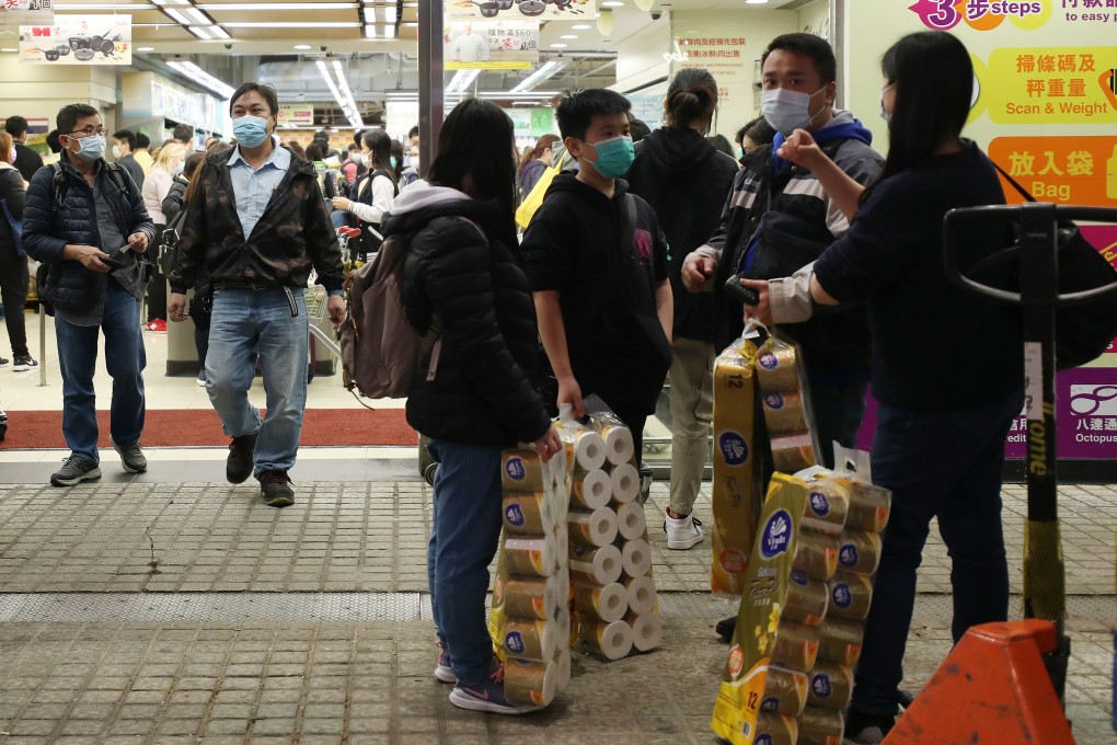 Shoppers with their hoard of toilet paper rolls outside a Wellcome supermarket in Causeway Bay on 15 February 2020. Photo: Xiaomei Chen