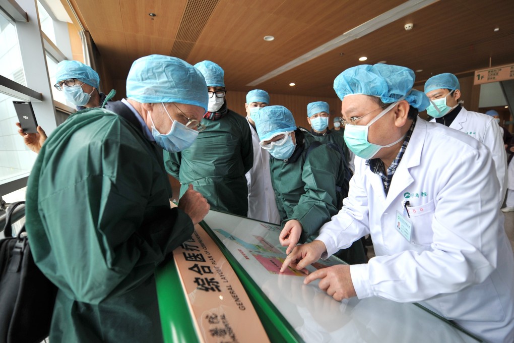 Members of the World Health Organisation’s coronavirus expert investigation group conduct field research at a hospital in Wuhan, capital of Hubei province and epicentre of the outbreak. Photo: TPG