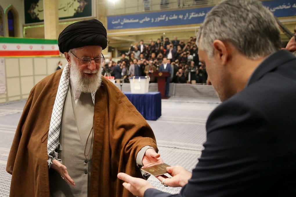 Iran's Supreme Leader Ayatollah Ali Khamenei cast his vote at a polling station last month. One of his advisers has died after falling ill from the new coronavirus. Photo: Reuters