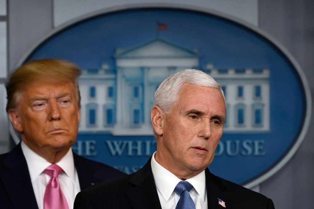 US President Donald Trump stands behind US Vice President Mike Pence. Photo: AFP