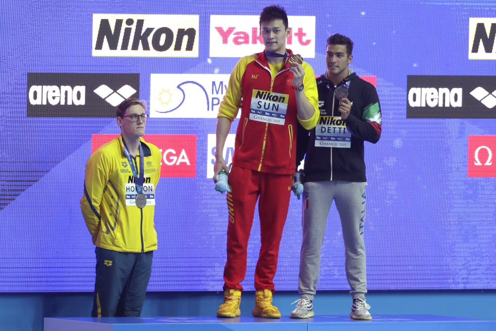 This photo of Mack Horton and Sun Yang, with bronze medallist Gabriele Detti, from last year’s world championships now holds even more meaning. Photo: AP