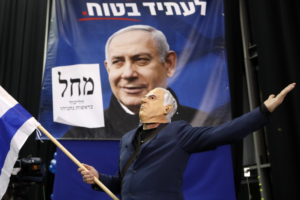 A supporter of Israeli Prime Minister Benjamin Netanyahu reacts to the announcement of exit poll results at the Likud party headquarters in Tel Aviv on Monday. Photo: Bloomberg