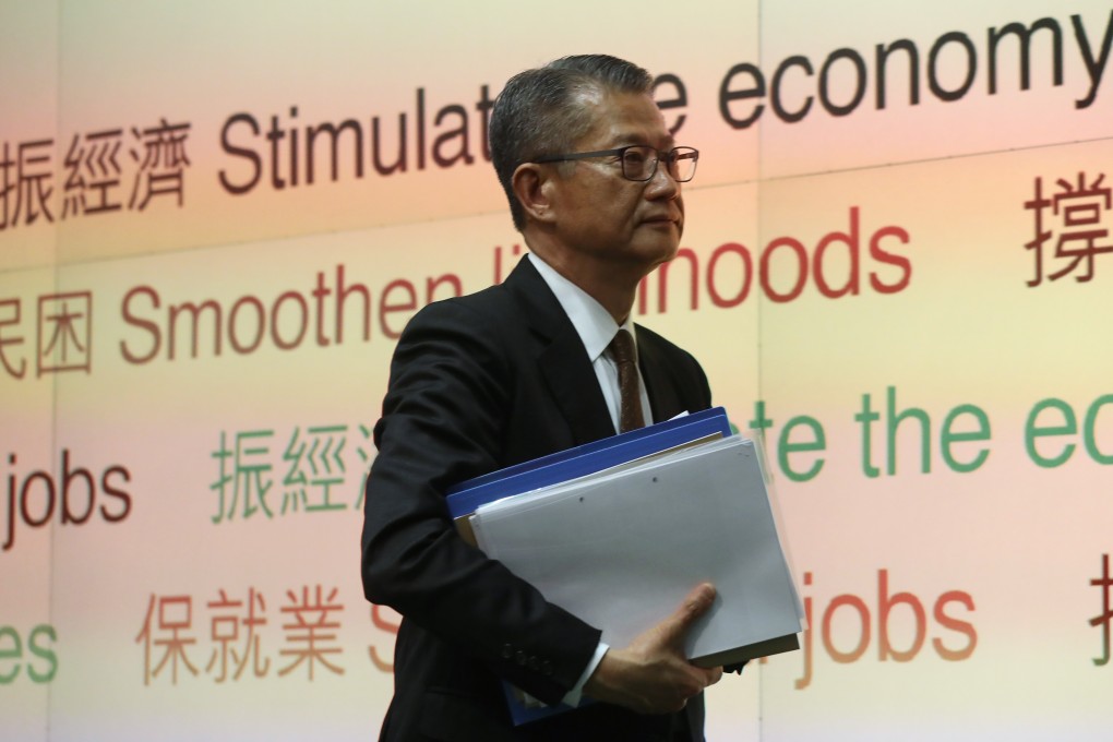 Financial Secretary Paul Chan arrives at a press conference after delivering the 2020-21 budget at the government headquarters in Tamar, Admiralty, on February 26. Photo: K.Y. Cheng
