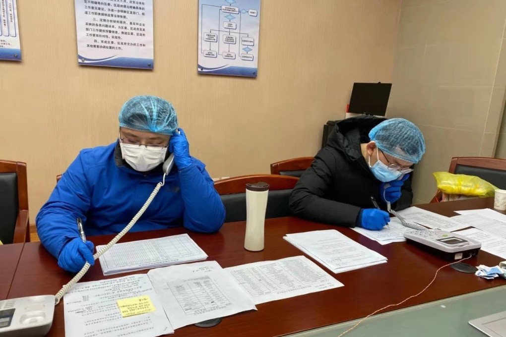 Volunteers at the Wuchang district community centre in Wuhan field floods of calls for help. Photo: Handout