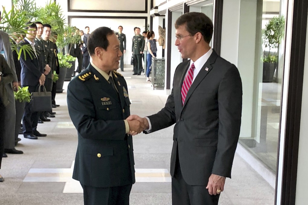 Chinese Defence Minister Wei Fenghe greets US Secretary of Defence Mark Esper in Bangkok in November. They spoke by phone on Tuesday. Photo: AP