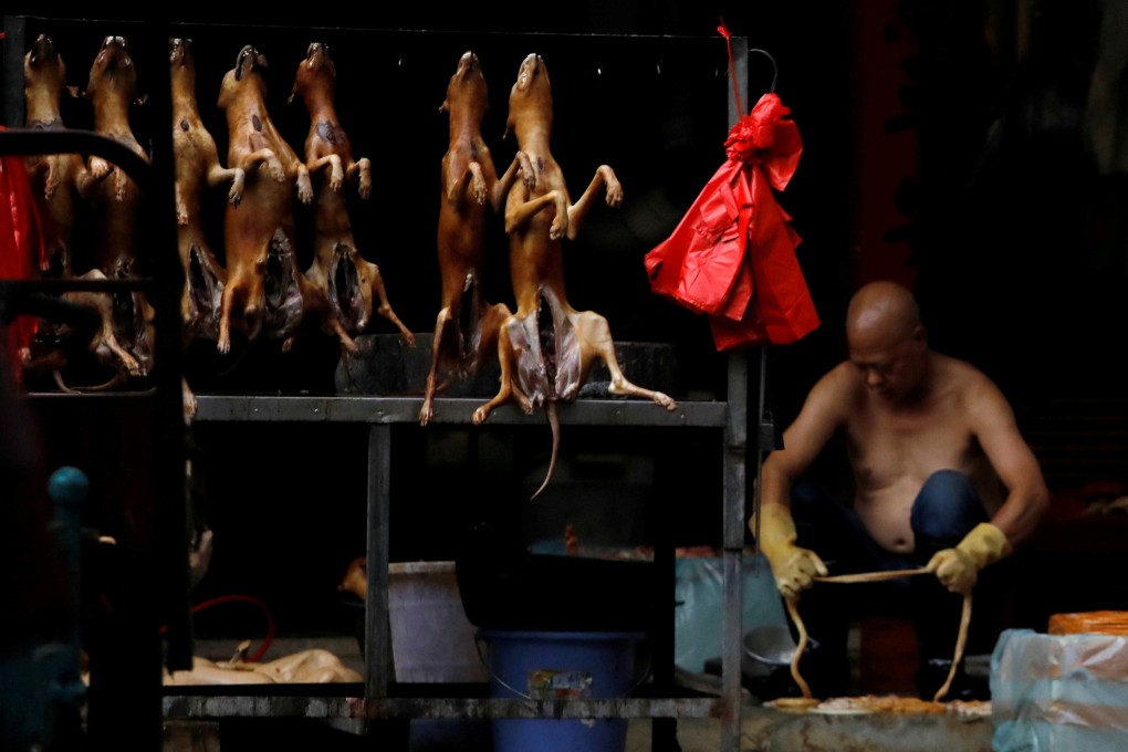 Butchered dogs are displayed for sale at a stall inside a meat market in Yulin, Guangxi region, in June 2018. Photo: Reuters