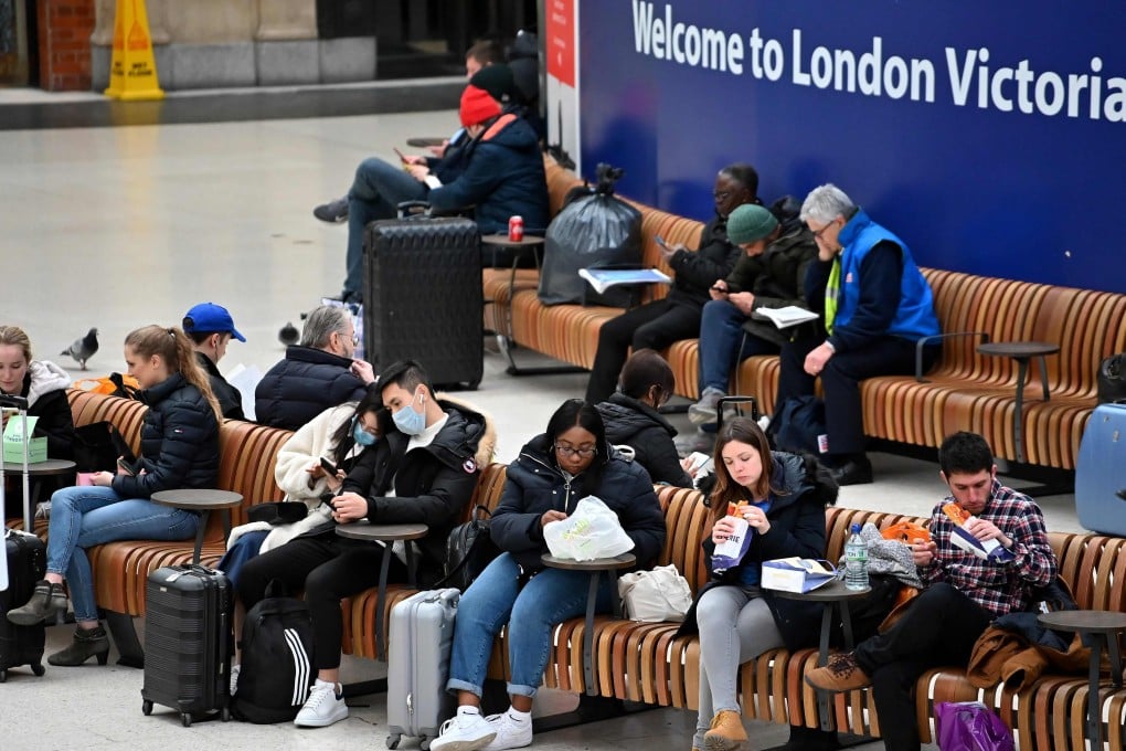 Travellers are seen on the concourse at London Victoria train station. Photo: AFP