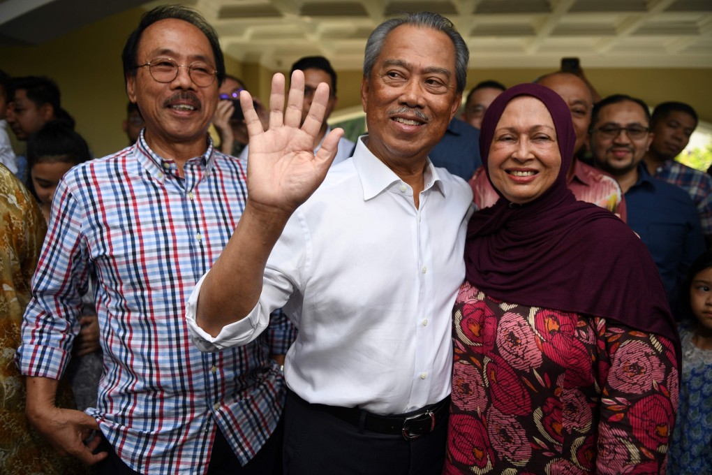 Malaysian Prime Minister Muhyiddin Yassin, alongside his wife Noraini Abdul Rahman. Photo: AFP