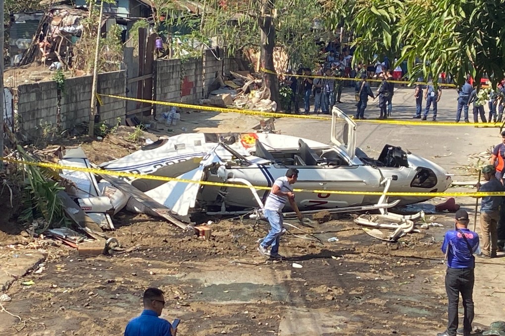 The site of a helicopter crash in San Pedro, south of Manila. Photo: AP