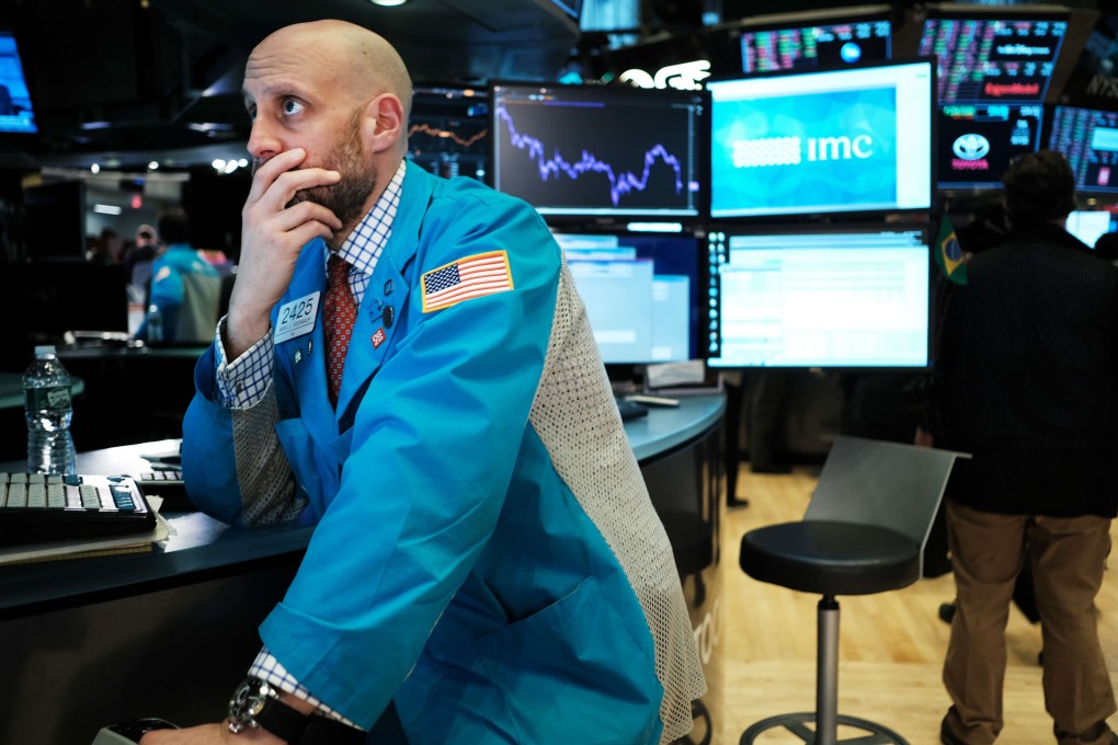 Traders work on the floor of the New York Stock Exchange on February 24. Last week, global stocks lost 13 per cent, wiping US$6 trillion off the value of equities. Photo: AFP