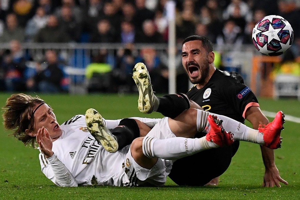 Real Madrid midfielder Luka Modric (left) and Manchester City midfielder Ilkay Gundogan clash during their Uefa Champions League match. Photo: AFP