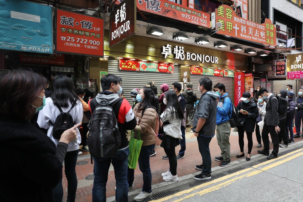 Queues for surgical masks in Causeway Bay, Hong Kong, in February. Photo: SCMP