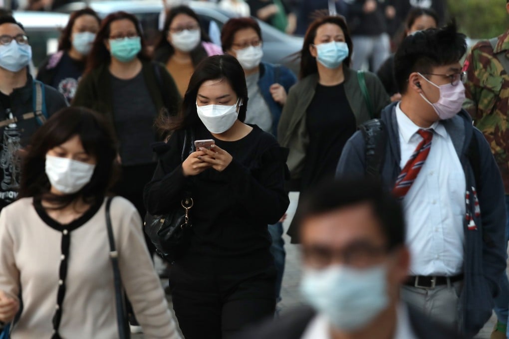 Hongkongers don surgical masks amid the coronavirus outbreak. Photo: Xiaomei Chen
