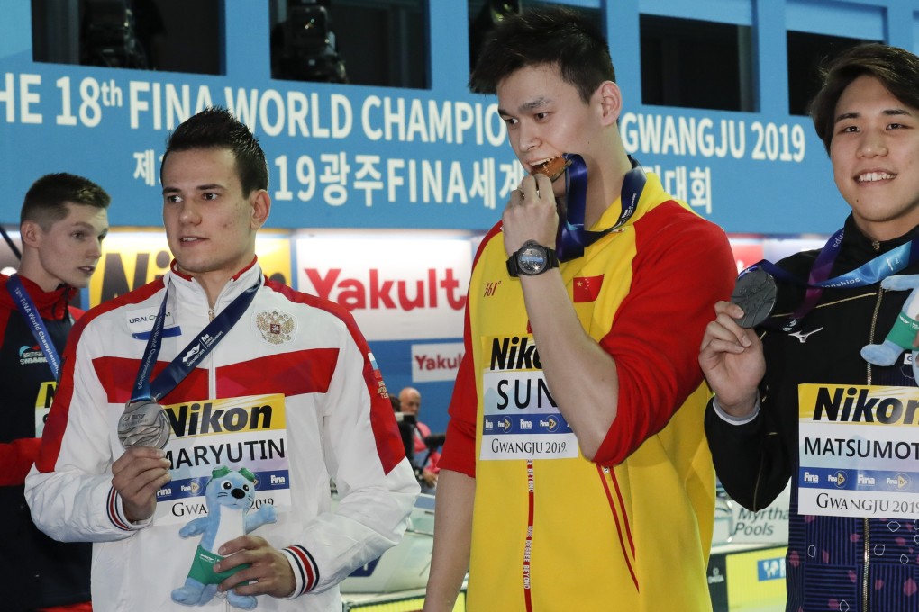 Sun Yang with Duncan Scott, Martin Malyutin and Katsuhiro Matsumoto at the medal ceremony at the 2019 world championships. Photo: AP