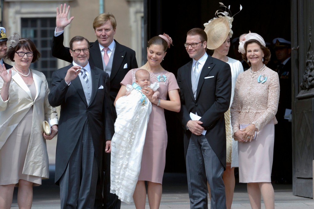 Sweden’s Crown Princess Victoria (centre) holds Princess Estelle after her christening ceremony in Stockholm in May 2012, attended by (from left) Ewa and Olle Westling, parents of Sweden’s Prince Daniel, Crown Prince Willem Alexander of the Netherlands, Denmark’s Crown Prince Daniel, and other royals. Photo: Reuters