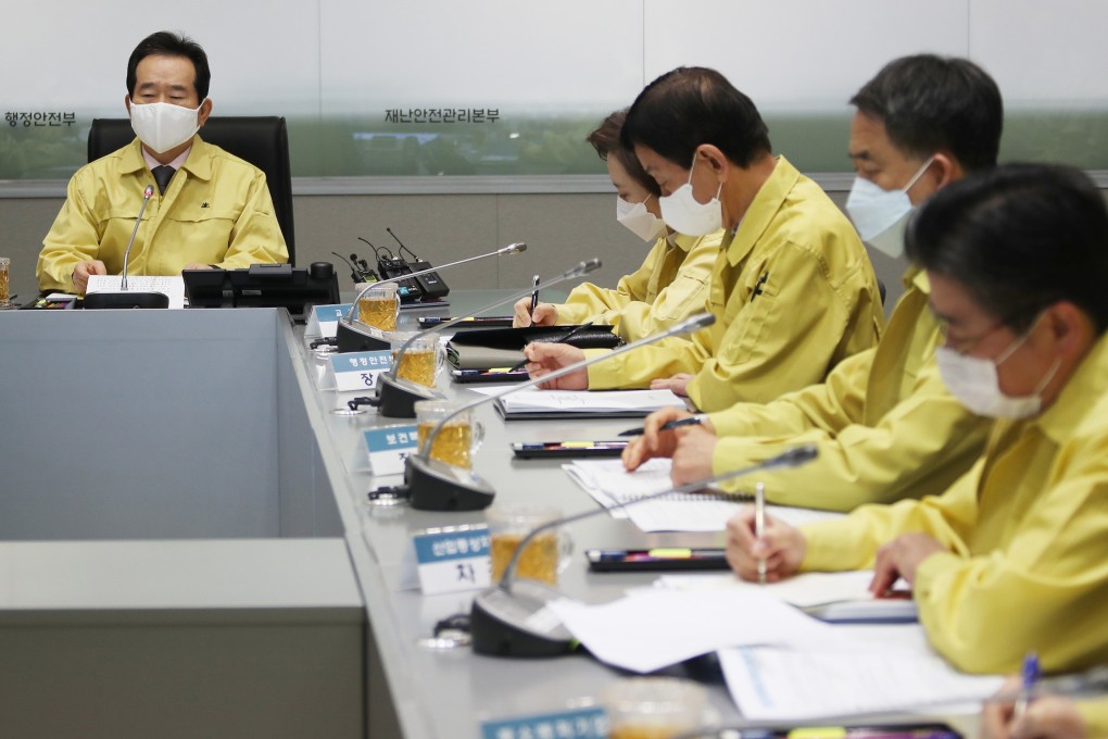 South Korean Prime Minister Chung Se-kyun, left, speaks during a meeting of the Central Disaster and Safety Countermeasures Headquarters at the government complex in Seoul. South Korea has criticised Japan's 14-day quarantine on all visitors from South Korea. Photo: AP