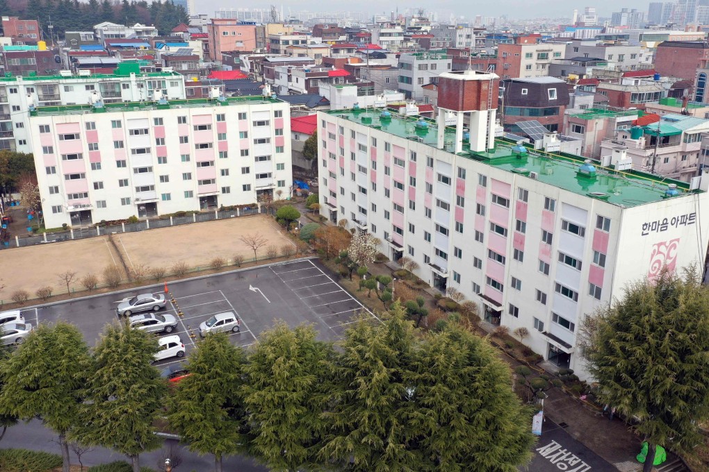 An aerial view of a residential building where 46 residents tested positive for coronavirus in Daegu. Photo: Yonhap/AFP