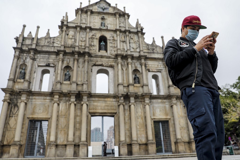 A man wearing a mask at the Ruins of St Paul’s in Macau. Photo: Winson Wong