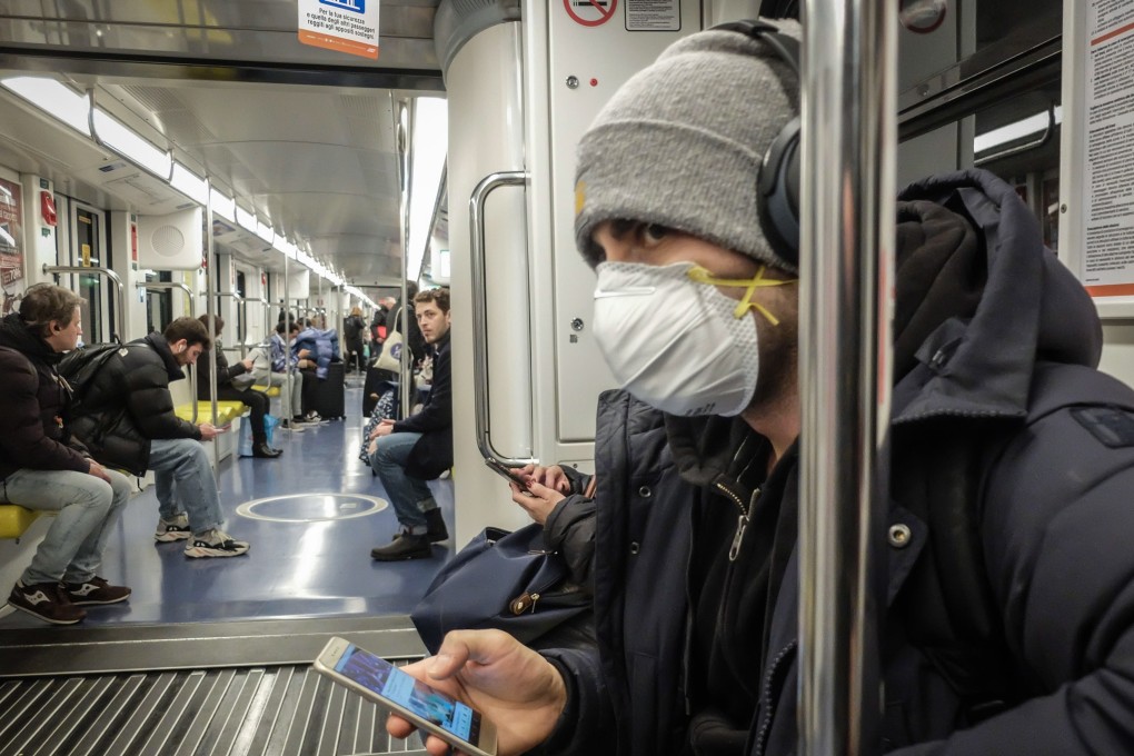 A man wearing a face mask on Milan's metro. Photo: EPA-EFE