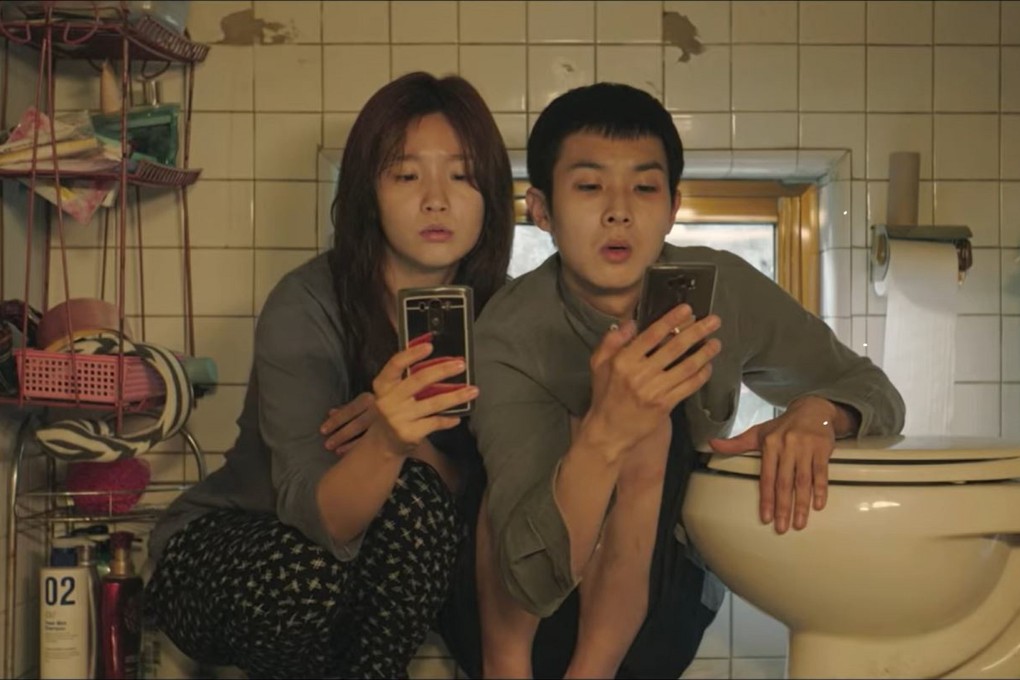 A scene from the film Parasite showing two of the characters inside a “banjiha” trying to access the internet. Photo: YouTube