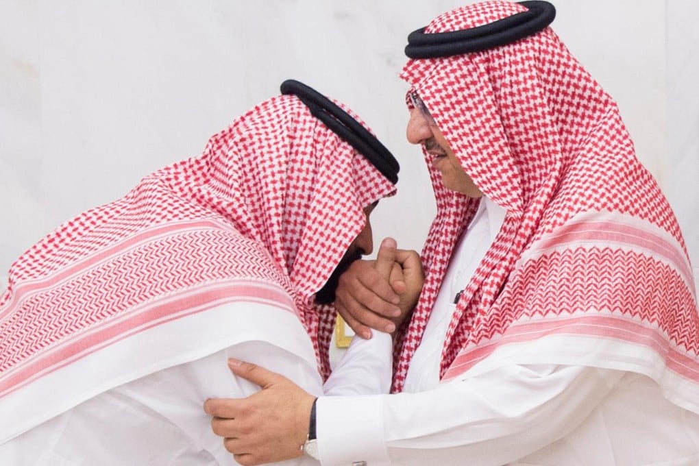 Mohammed bin Salman, (MBS) then newly appointed as crown prince, left, kisses the hand of Prince Mohammed bin Nayef at a royal palace in Mecca, Saudi Arabia in 2017. Mohammed bin Nayef has been accused of treason. File photo: AFP