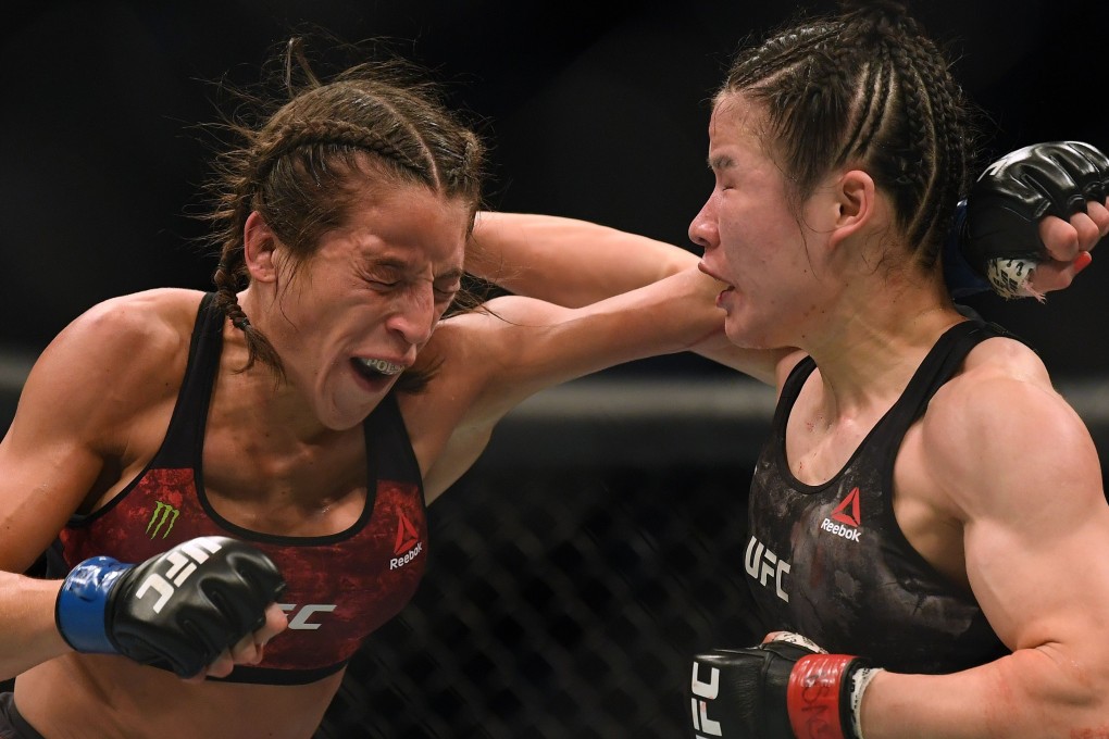 Weili Zhang punches Joanna Jedrzejczyk on her way to a split decision win at T-Mobile Arena. Photo: AFP